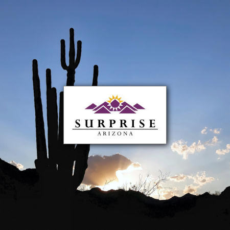 A photo of the Surprise, AZ logo with cactus in the background