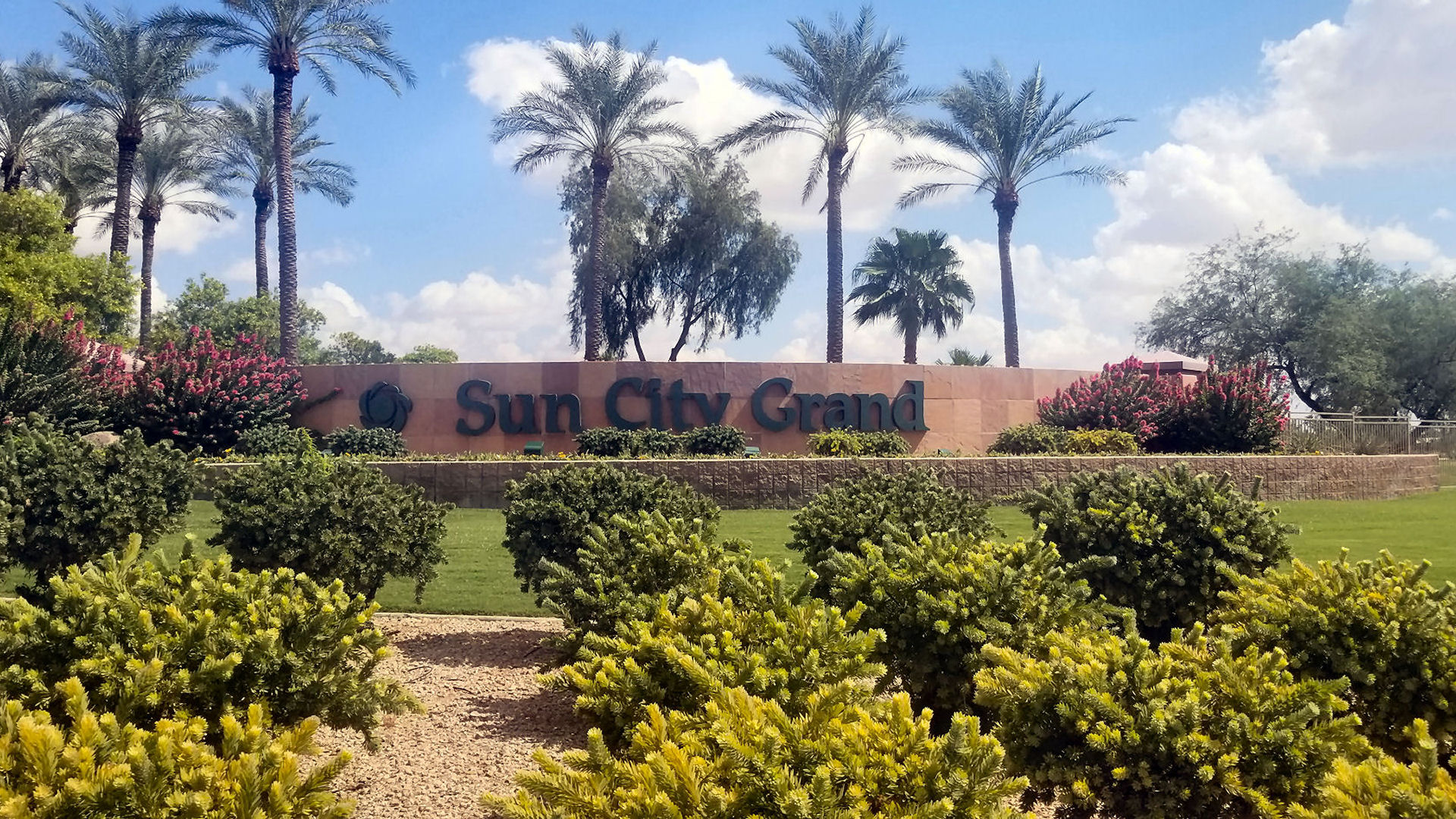 Photo of Sun City Grand entrance wall and landscaping