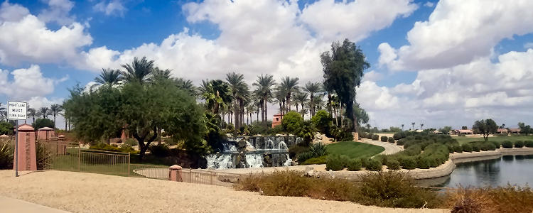 Sun City Grand entrance view of waterfall and landscape